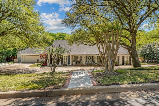 1905 Indian Creek Dr, Westover Hills, TX 76107 - view of front of property with concrete driveway, an attached garage, and a front yard
