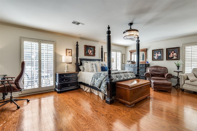 1905 Indian Creek Dr, Westover Hills, TX 76107 - bedroom featuring ornamental molding, multiple windows, and hardwood / wood-style floors
