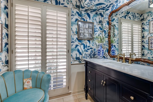 1905 Indian Creek Dr, Westover Hills, TX 76107 - bathroom featuring wallpapered walls, healthy amount of natural light, baseboards, tile patterned floors, and vanity