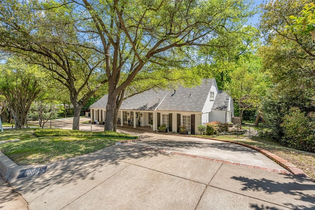 1905 Indian Creek Dr, Westover Hills, TX 76107 - view of front of house with fence and concrete driveway