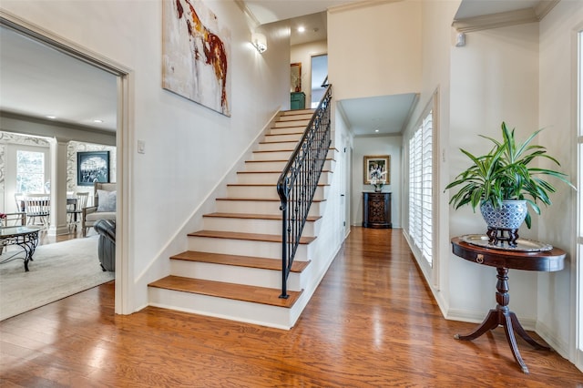 1905 Indian Creek Dr, Westover Hills, TX 76107 - staircase with wood finished floors, ornate columns, baseboards, recessed lighting, and a towering ceiling