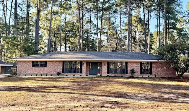 single story home with brick siding