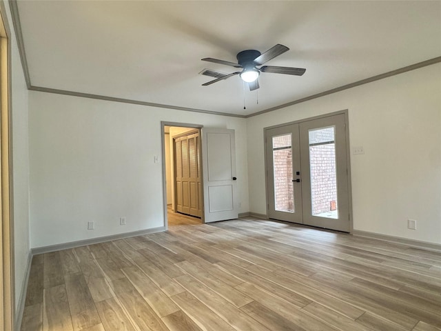 spare room featuring french doors, baseboards, visible vents, and light wood finished floors