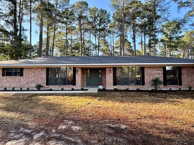 ranch-style house with brick siding