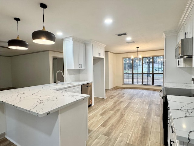 kitchen with light wood-type flooring, ornamental molding, a peninsula, stainless steel appliances, and white cabinetry