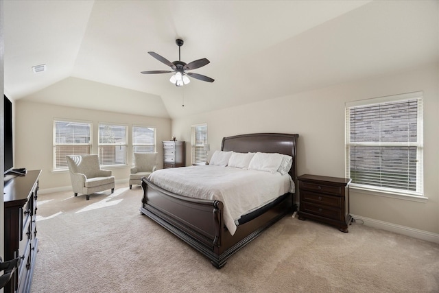 bedroom featuring visible vents, a ceiling fan, baseboards, lofted ceiling, and light colored carpet