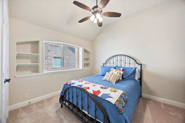 carpeted bedroom featuring baseboards, ceiling fan, and vaulted ceiling