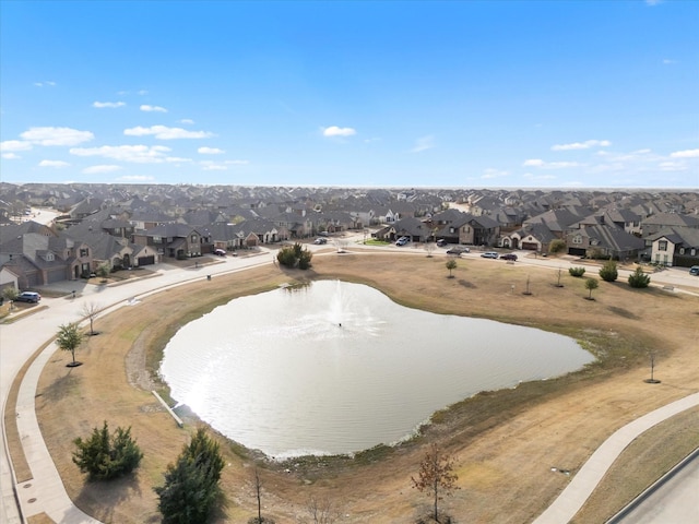 bird's eye view with a residential view and a water view