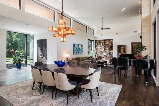 dining space with floor to ceiling windows, recessed lighting, wood finished floors, and visible vents