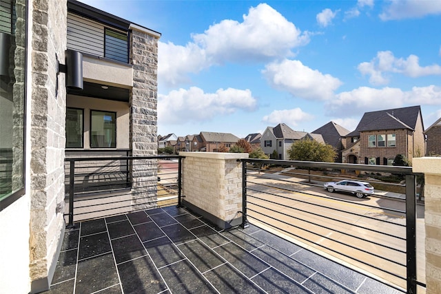 wooden deck featuring a residential view