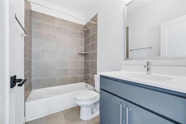 bathroom featuring tile patterned flooring, vanity, toilet, and shower / bathing tub combination