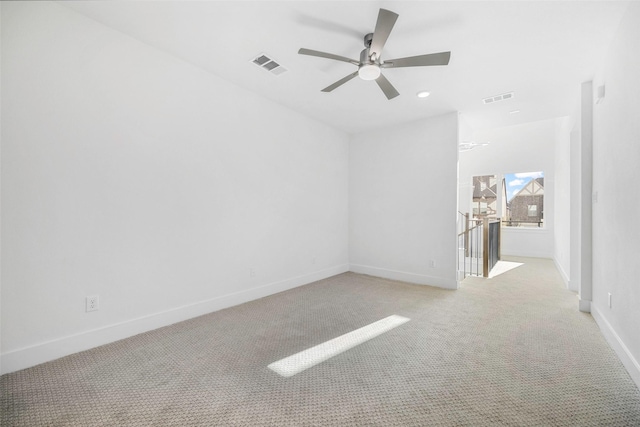 unfurnished room featuring recessed lighting, baseboards, visible vents, and light carpet