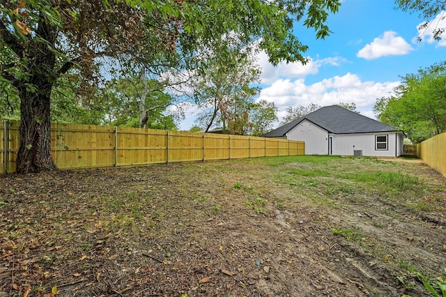 view of yard with a fenced backyard