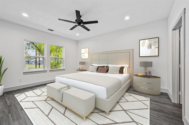 bedroom with visible vents, recessed lighting, baseboards, and wood finished floors