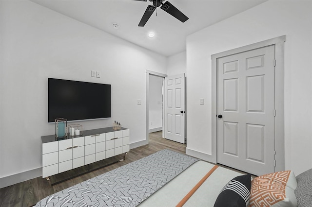 bedroom featuring ceiling fan, baseboards, wood finished floors, and recessed lighting