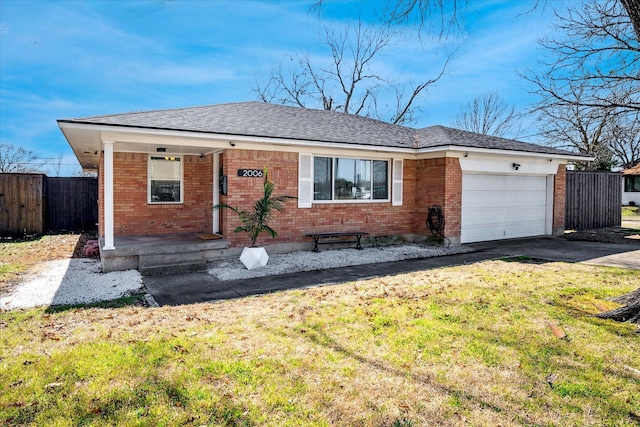 single story home featuring fence, covered porch, concrete driveway, an attached garage, and brick siding