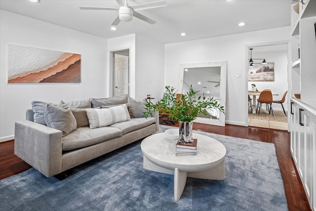 living room featuring recessed lighting, baseboards, wood finished floors, and a ceiling fan