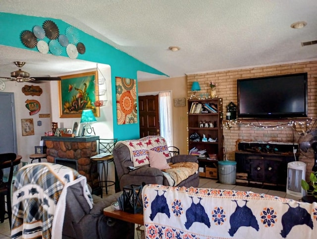 living room with visible vents, a textured ceiling, a fireplace, ceiling fan, and vaulted ceiling