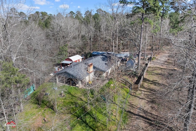 birds eye view of property with a forest view