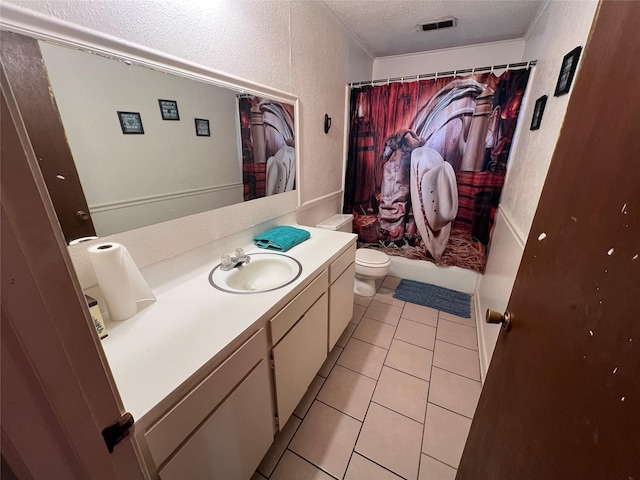 bathroom featuring toilet, a textured ceiling, tile patterned flooring, vanity, and a textured wall