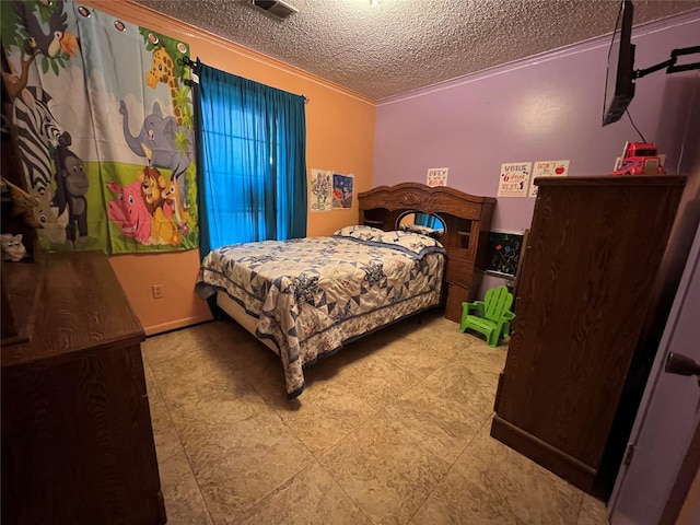 bedroom featuring a textured ceiling, visible vents, and ornamental molding