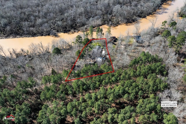 birds eye view of property with a wooded view