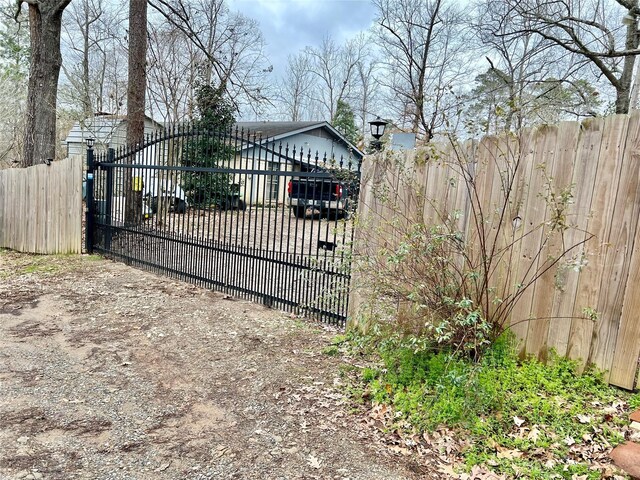 view of gate featuring fence