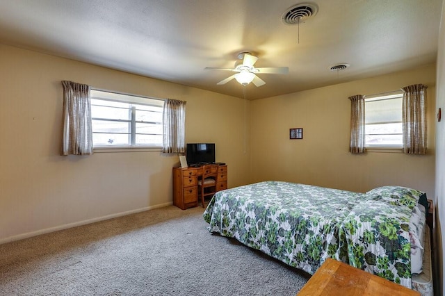 bedroom with visible vents, ceiling fan, baseboards, and carpet