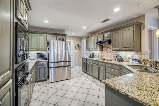 kitchen featuring visible vents, light tile patterned flooring, a sink, black appliances, and under cabinet range hood