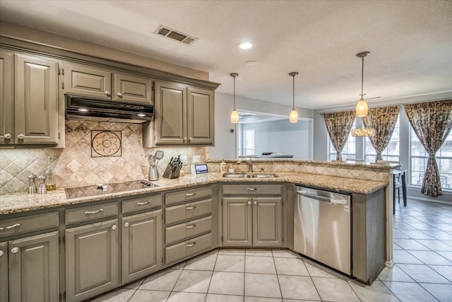 kitchen featuring visible vents, black electric stovetop, under cabinet range hood, dishwasher, and a sink