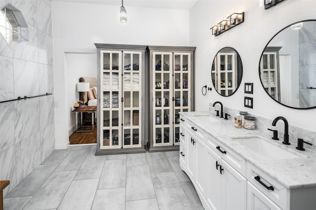 bathroom with double vanity and a sink