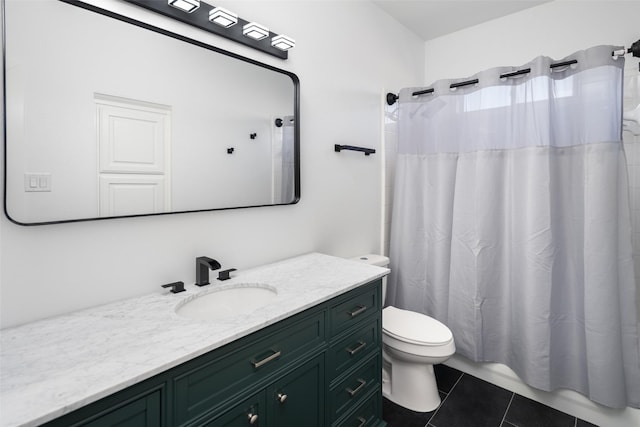 bathroom featuring tile patterned flooring, a shower with shower curtain, toilet, and vanity