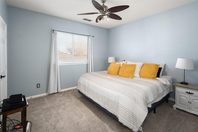 carpeted bedroom with visible vents, ceiling fan, and baseboards