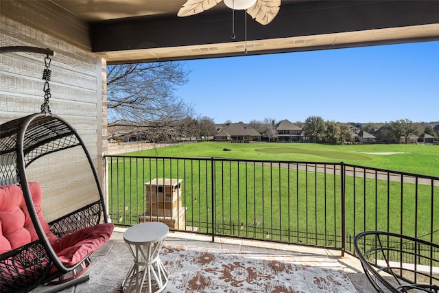 balcony featuring a ceiling fan