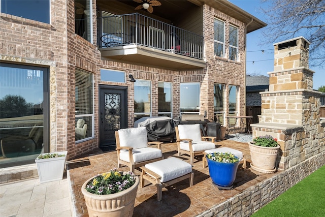 view of patio / terrace featuring area for grilling and a balcony