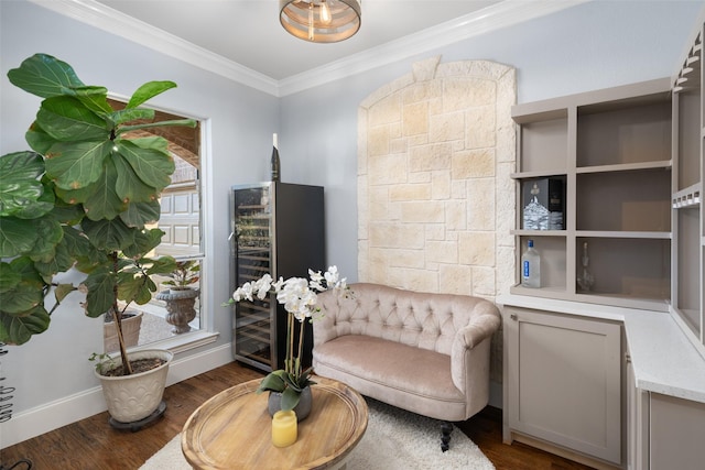 living area with dark wood finished floors, wine cooler, baseboards, and ornamental molding