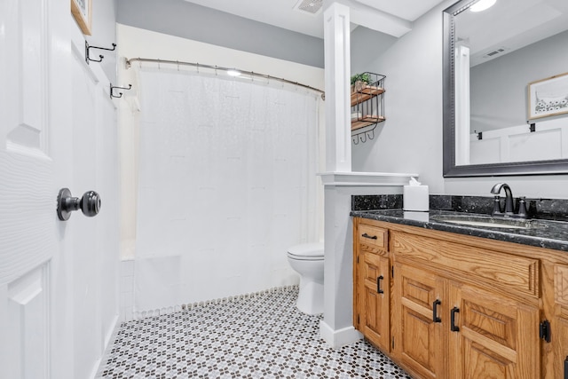 bathroom with a shower with shower curtain, visible vents, toilet, and vanity