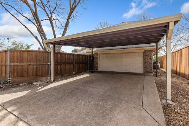 exterior space featuring a carport, concrete driveway, and fence