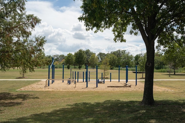 view of home's community featuring a yard and playground community