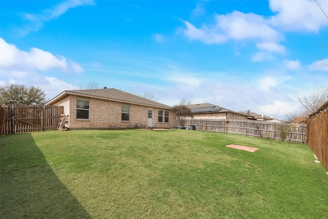 view of yard with a fenced backyard