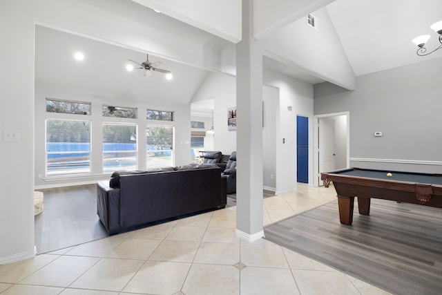 rec room featuring visible vents, high vaulted ceiling, a ceiling fan, light tile patterned flooring, and baseboards