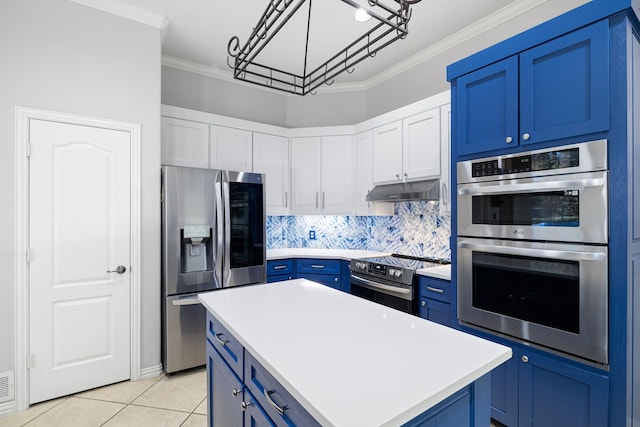 kitchen with under cabinet range hood, stainless steel appliances, blue cabinets, and ornamental molding