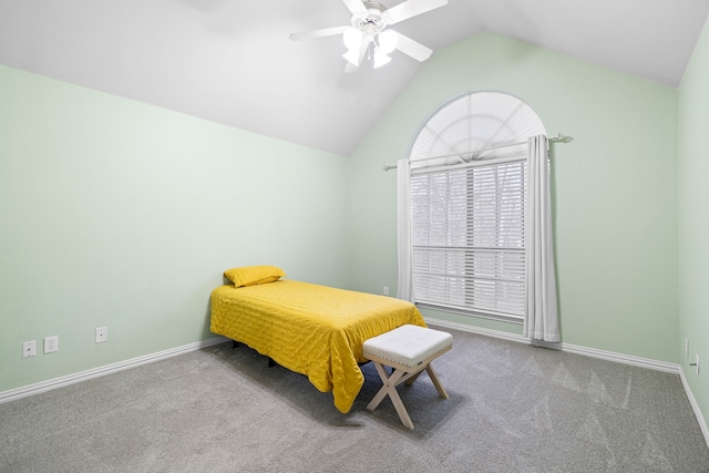 carpeted bedroom featuring baseboards, lofted ceiling, and a ceiling fan