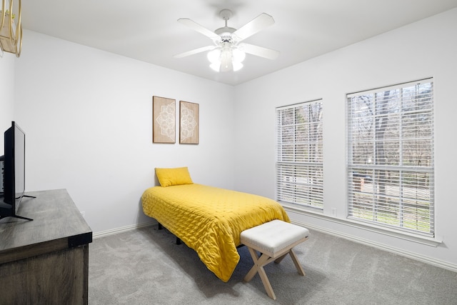 bedroom with baseboards, carpet floors, and ceiling fan