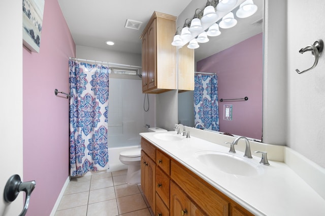 full bath featuring tile patterned floors, visible vents, double vanity, and a sink