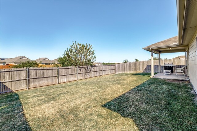 view of yard featuring a fenced backyard and a patio area