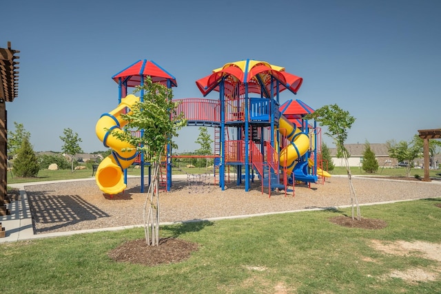 community jungle gym featuring a yard