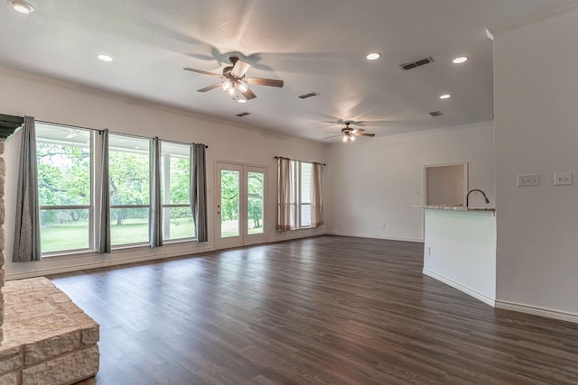 unfurnished room featuring dark wood-style floors, visible vents, and crown molding