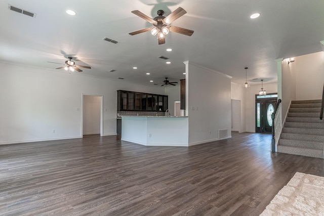 unfurnished living room with stairs, recessed lighting, visible vents, and dark wood-style flooring