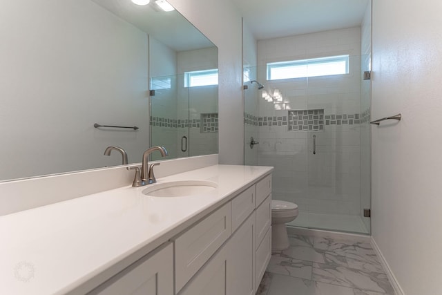 full bathroom with toilet, marble finish floor, a shower stall, baseboards, and vanity